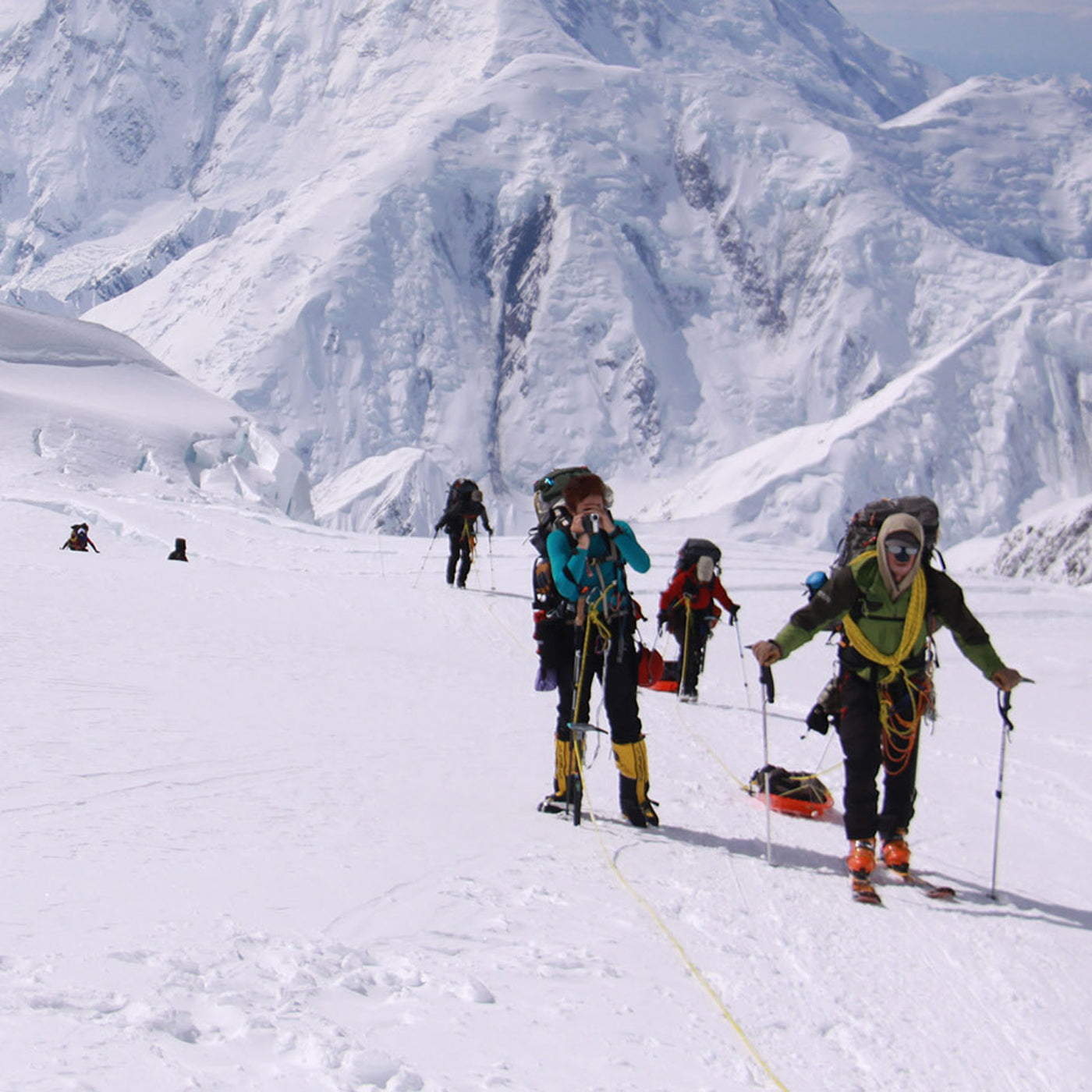 People skiing in the mountains. 