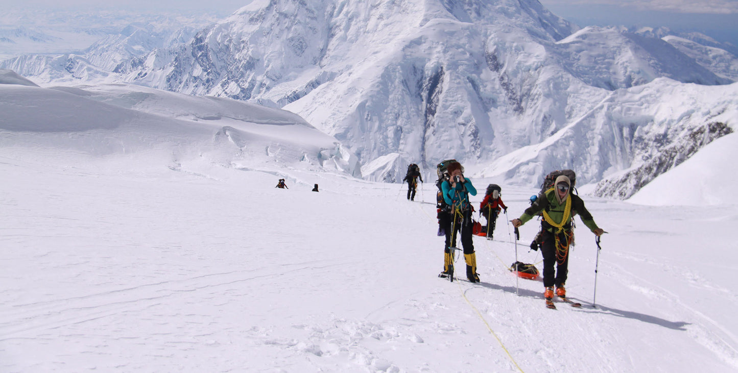 People skiing in the mountains. 