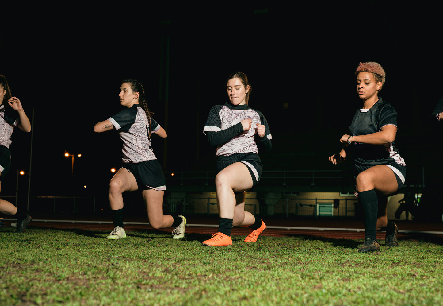 People stretching before a sports game. 